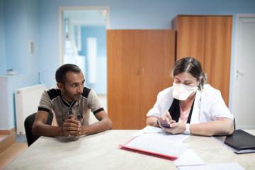 Medical staff work in the ambulatory ward at the National Centre for Tuberculosis and Lung Disease in Georgia’s capital, Tbilisi. Patient Goderdzi Rajabishvili (left) recovers from his morning infusion of imipenem, an antibiotic drug used for the treatment of MDR-TB. (Daro Sulakauri)